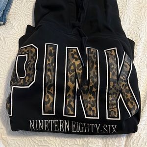 Victoria’s Secret “Pink” black cheetah hoodie.